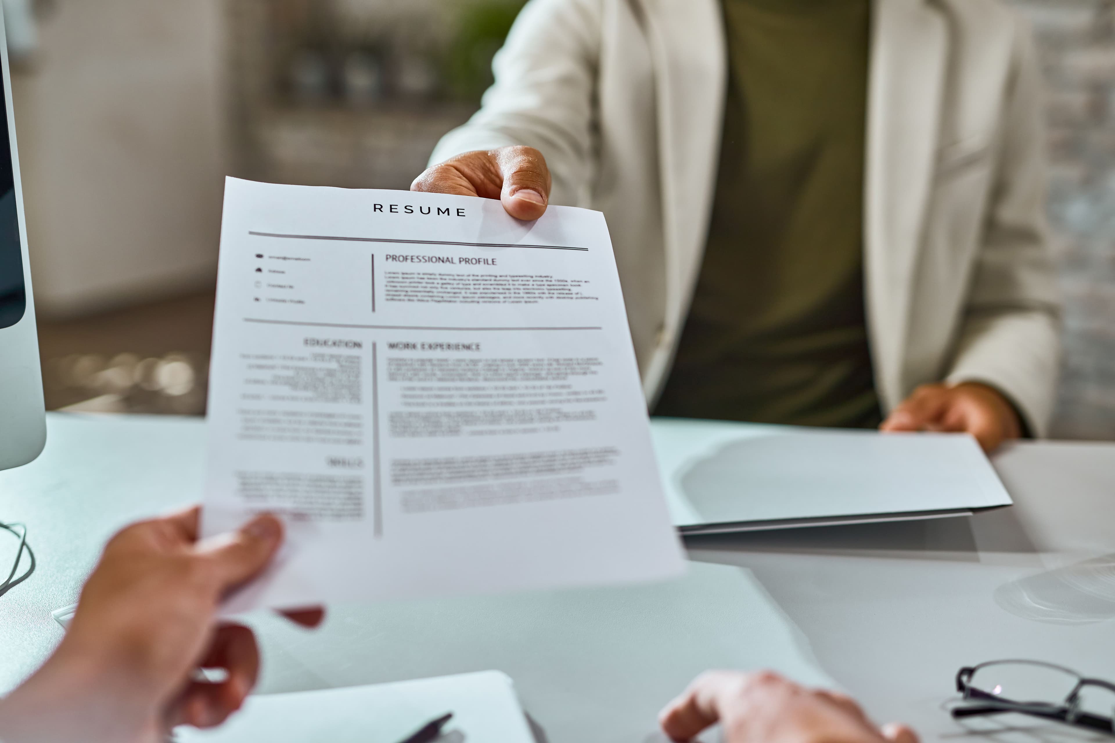 closeup-job-applicant-giving-his-resume-job-interview-office.jpg | CVWisely